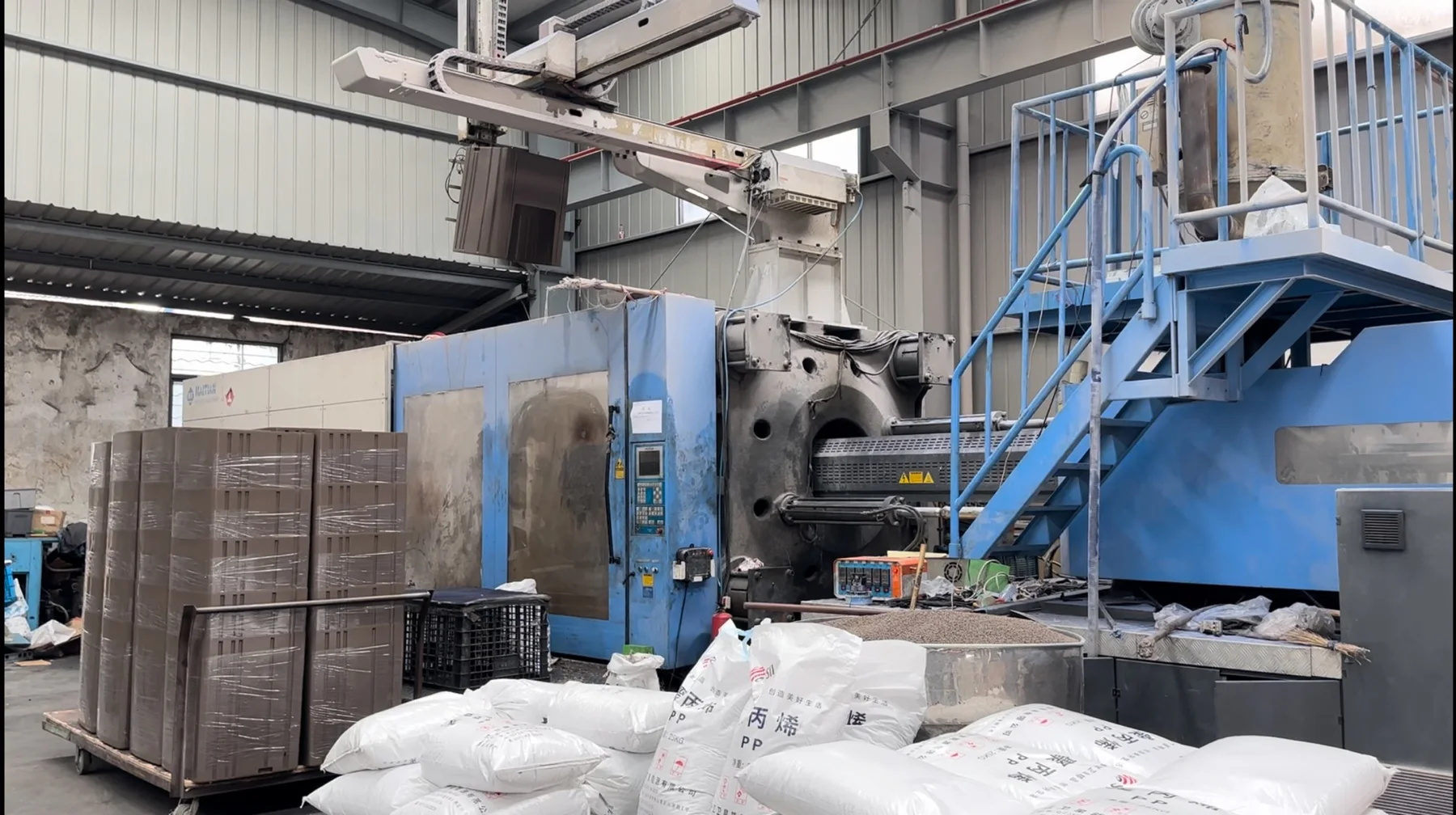 Supplied photograph of an injection-moulding work area